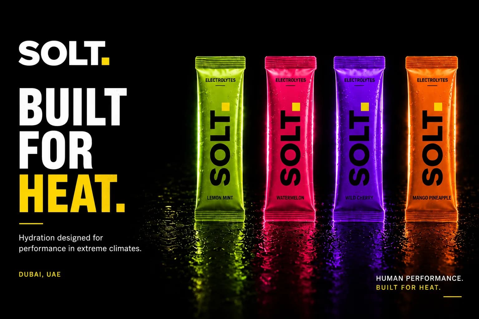 Four SOLT electrolyte sachets in green, pink, purple and orange on a wet dark surface, built for heat.