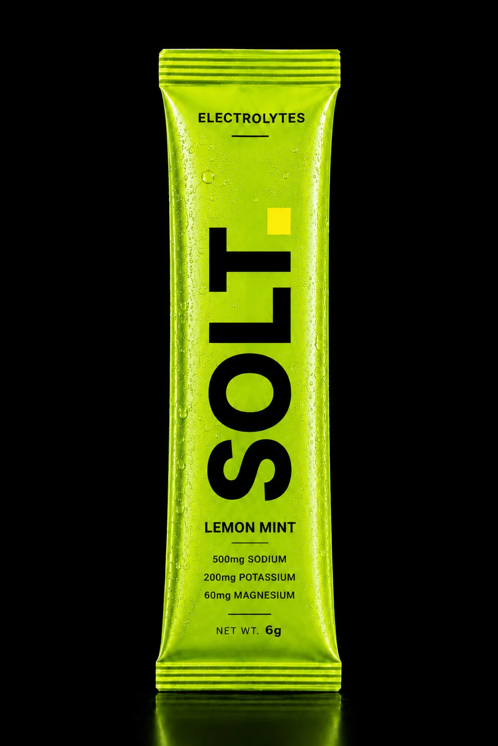 SOLT Lemon Mint sachet, vivid green pack on a dark stage. Real Himalayan salt, zero sugar.