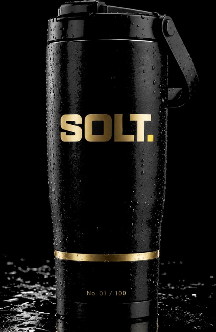 SOLT Founders Edition tumbler, matte black with a gold wordmark and engraved serial number.